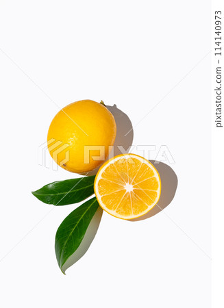 Fresh cut lemons on isolated white background with shadow and leaves. 114140973