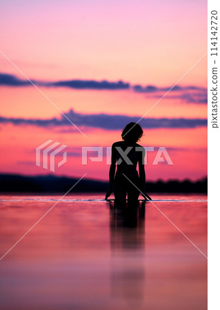 Women silhouette sunset on the lake Women silhouette sunset on the lake 114142720