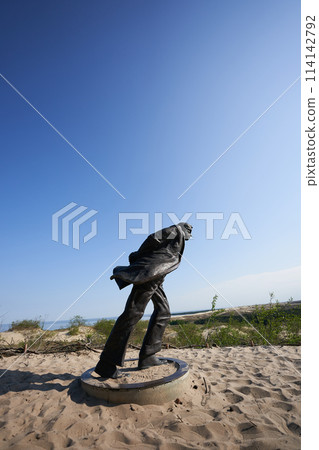 Jean Paul Sartre statue on dunes 114142792