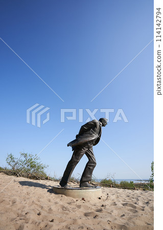 Jean Paul Sartre statue on dunes 114142794