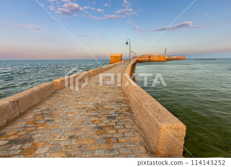 Fort Saint Sebastian and the bridge to it at dawn. Fort Saint Sebastian and the bridge to it at dawn. 114143252