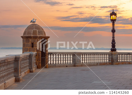 Old corner fortification tower on the Cadiz waterfront. Old corner fortification tower on the Cadiz waterfront. 114143260