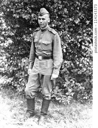 Portrait of a soldier of the Soviet Army. Vintage black and white photo on paper. USSR, circa 1968. Portrait of a soldier of the Soviet Army. Vintage black and white photo on paper. USSR, circa 1968. 114143373
