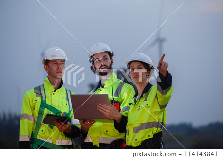 Engineer wearing safety uniform using tablet discussed plan about renewable energy 114143841
