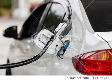 Close Up of pump nozzle Compressed Natural Gas (cng) in tank for car.  114144718