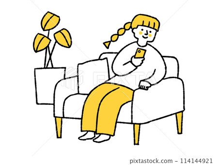 A woman sitting on a sofa and looking at her smartphone A woman sitting on a sofa and looking at her smartphone 114144921