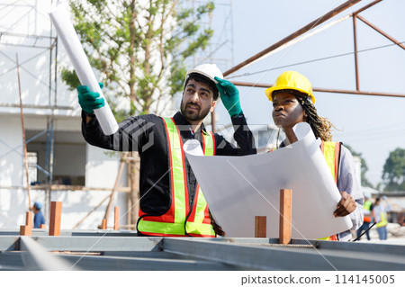Construction civil engineer man and woman African American checking quality of work 114145005