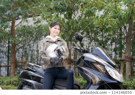 Portrait of a woman riding a bike Portrait of a woman riding a bike 114146050