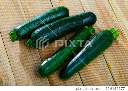 Organic zucchini on wooden cutting board. Healthy nutrition concept 114146377