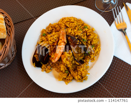 Portion of fresh seafood paella Portion of fresh seafood paella 114147761