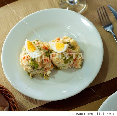 Spanish salad called Ensalada rusa 114147804