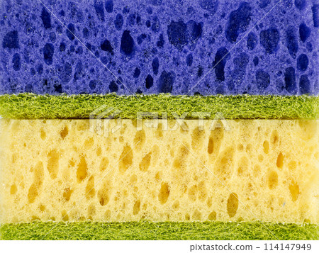 Close up of horizontally stacked sponges in blue, yellow colors 114147949