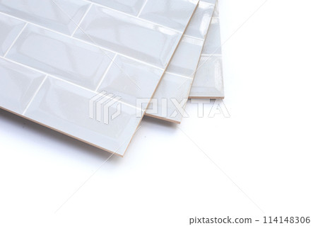 Pile of wall tiles on white background. 114148306