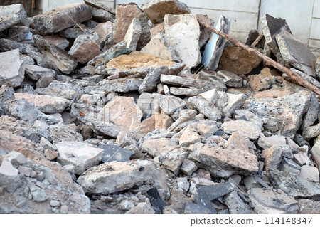 Piles of rubble after house demolition 114148347