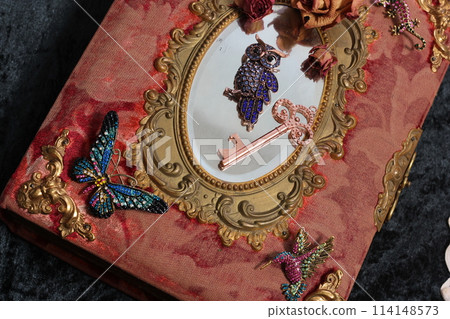 Antique Book With Colorful Gemstones and Mirror. Fairy Tale Romance Book Antique Book With Colorful Gemstones and Mirror. Fairy Tale Romance Book 114148573