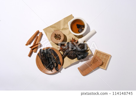 Flat lay herbs and wooden tools on minimalist background with the main composition is black locust fruits. Photo for design banner or poster of products made from locust Flat lay herbs and wooden tools on minimalist background with the main composition is black locust fruits. Photo for design banner or poster of products made from locust 114148745