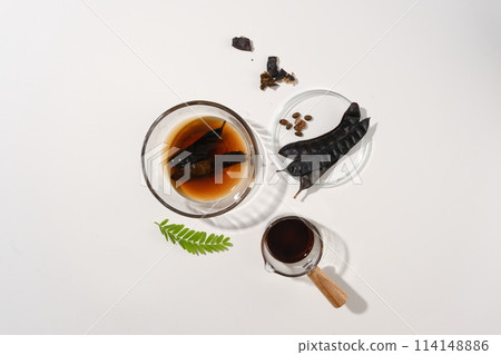 Fresh composition for cosmetic or shampoo made from black locust isolated on minimalist background. High angle shot photo with blank space for advertising Fresh composition for cosmetic or shampoo made from black locust isolated on minimalist background. High angle shot photo with blank space for advertising 114148886