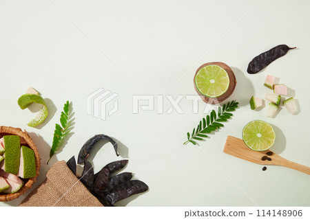 Creative background for cosmetic products with organic ingredient such as black locust, lemon and grapefruit. Vacant space for displaying product or adding text Creative background for cosmetic products with organic ingredient such as black locust, lemon and grapefruit. Vacant space for displaying product or adding text 114148906