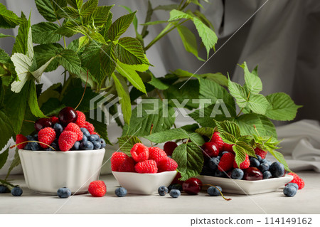 Colorful assorted mix of blueberries, raspberries, and sweet cherries. Colorful assorted mix of blueberries, raspberries, and sweet cherries. 114149162