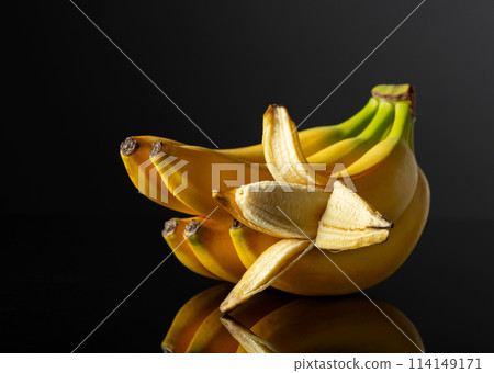 Bananas on a black reflective background. Bananas on a black reflective background. 114149171
