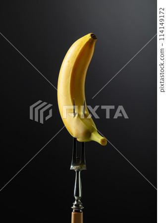 Juicy banana on a black background. 114149172