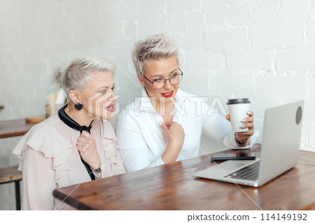 two businesswoman using laptop in morning. Business, financial People and lifestyles 114149192