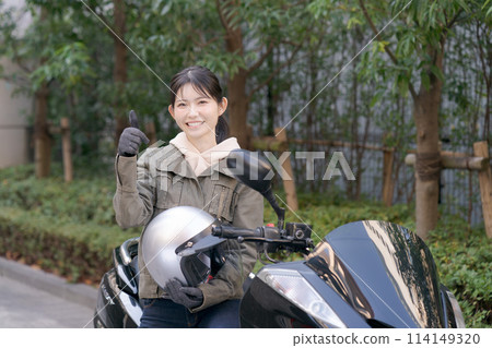Portrait of a woman riding a bike 114149320