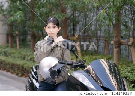  Woman riding a bike 114149337