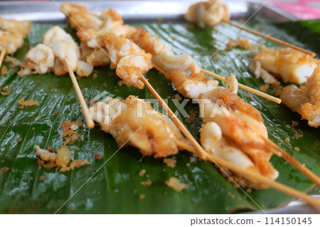 Squid eggs grilled on banana leaf. Seafood on street food in Thailand 114150145