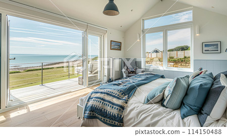 Beautiful interior of luxury bedroom with window sea view. Coastal cottage concept. High quality photo 114150488