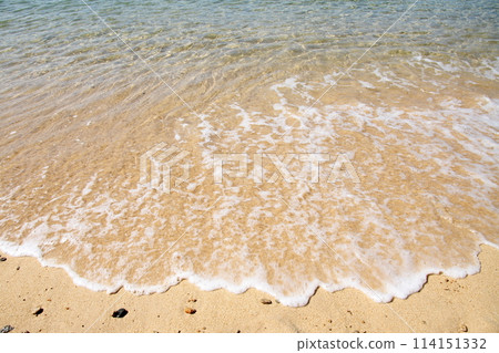 A beautiful beach with waves lapping on the shore of Umashima Island in the Kurushima Strait A beautiful beach with waves lapping on the shore of Umashima Island in the Kurushima Strait 114151332