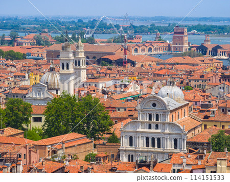 A view of the red tiled roofs of a cityscape from a high vantage point (from the bell tower of St. Mark's Basilica, Venice, Italy) 114151533