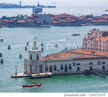 An old triangular building on a promontory and an old sailing ship under restoration at anchor (Punta della Dogana, Venice, Italy) An old triangular building on a promontory and an old sailing ship under restoration at anchor (Punta della Dogana, Venice, Italy) 114151537