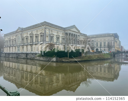 Ghent, Belgium The Palace of Justice, historic building reflecting in the canal 114152365