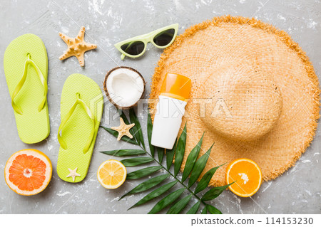 Top view of various seashells placed near colorful fruit and stylish summer accessories on table background. Summer concept. Flat lay. Top view with copy space for text Top view of various seashells placed near colorful fruit and stylish summer accessories on table background. Summer concept. Flat lay. Top view with copy space for text 114153230