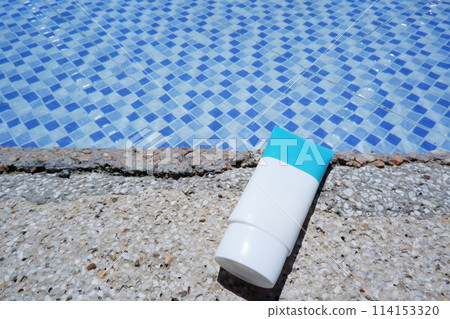 UV care tube placed by the pool, skin care mockup UV care tube placed by the pool, skin care mockup 114153320
