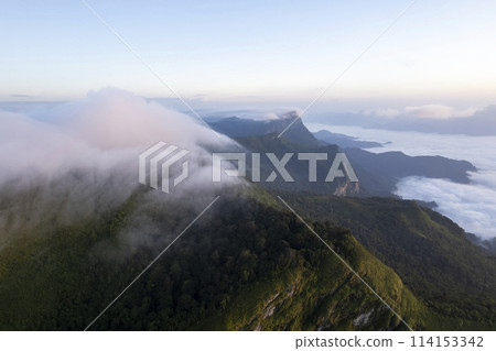 Landscape of Morning Mist with Mountain Layer at north of Thailand. mountain ridge and clouds in rural jungle bush fores Landscape of Morning Mist with Mountain Layer at north of Thailand. mountain ridge and clouds in rural jungle bush fores 114153342