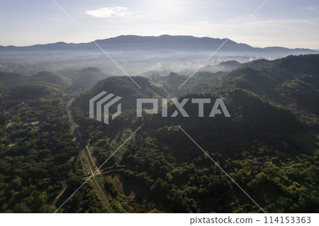 Landscape of Morning Mist with Mountain Layer at north of Thailand. mountain ridge and clouds in rural jungle bush fores 114153363