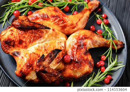 butterflied, spatchcock roast chicken on a plate 114153604