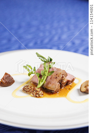 Main beef steak of the French course, fashionable presentation stock image Main beef steak of the French course, fashionable presentation stock image 114154801