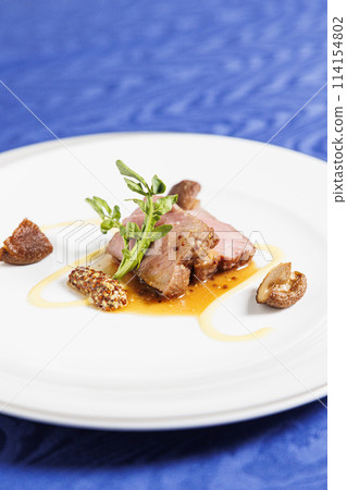 Main beef steak of the French course, fashionable presentation stock image Main beef steak of the French course, fashionable presentation stock image 114154802