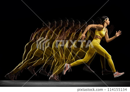 Dynamic image of young woman in yellow sportswear in motion, training, running against black background with stroboscope effect 114155134