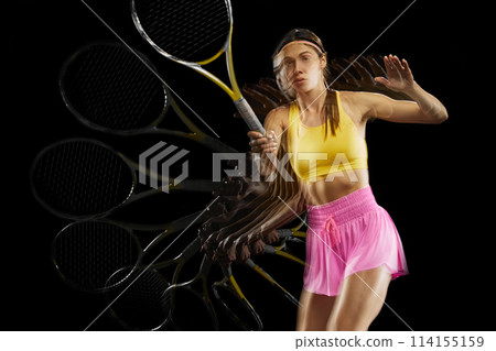 Athletic young woman in motion, tennis player training with focus against black background with stroboscope effect 114155159