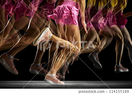 Power and athleticism. Cropped image of athletic, muscular female legs in motion, running against black background with stroboscope effect. 114155189
