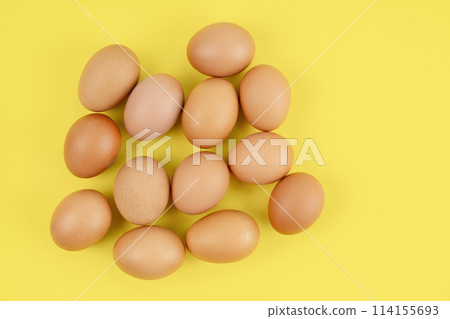 The Fresh eggs on yellow background, Position with copy space. 114155693