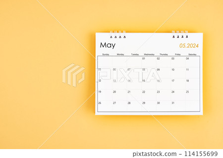 May 2024 desk calendar on yellow color background, position with copy space. May 2024 desk calendar on yellow color background, position with copy space. 114155699