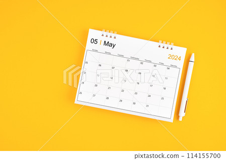 May 2024, Monthly desk calendar for 2024 year and pen on yellow background. May 2024, Monthly desk calendar for 2024 year and pen on yellow background. 114155700