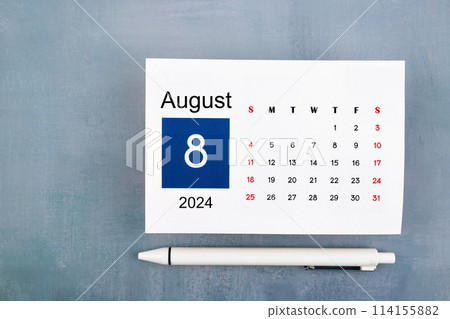 August Calendar 2024 page with pen on wooden background. August Calendar 2024 page with pen on wooden background. 114155882