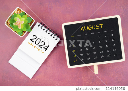 Calendar for Augusty 2024 in black chalkboard on red background. 114156058
