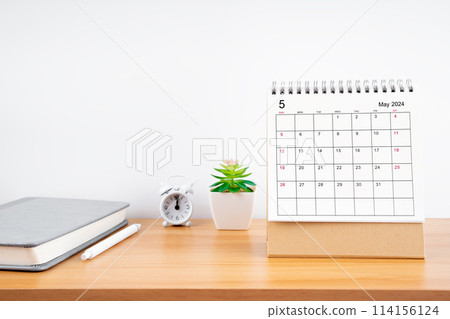 May 2024, Monthly desk calendar for 2024 year on wooden table. May 2024, Monthly desk calendar for 2024 year on wooden table. 114156124